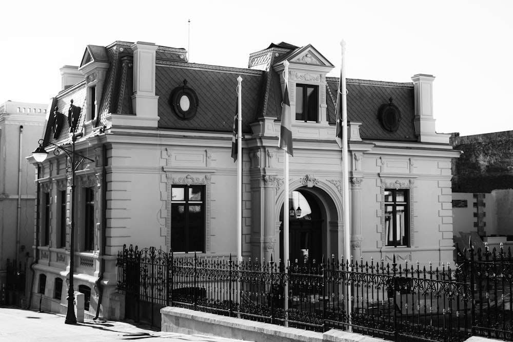 a building with a fence in front