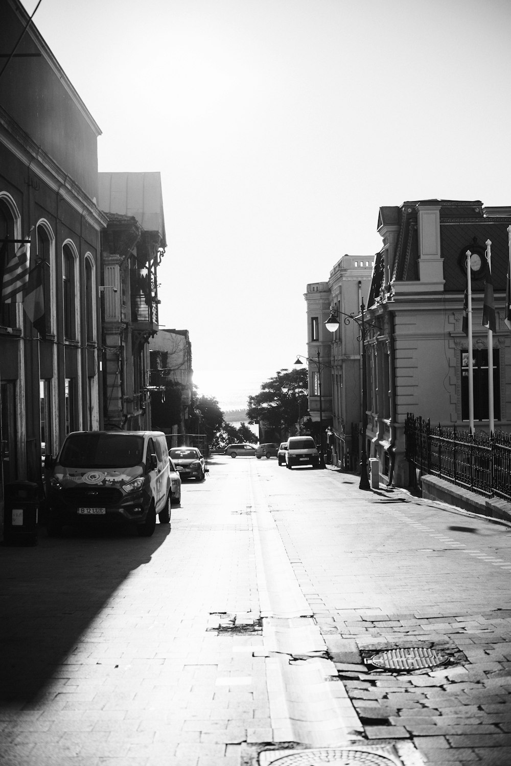 a street with cars parked on the side