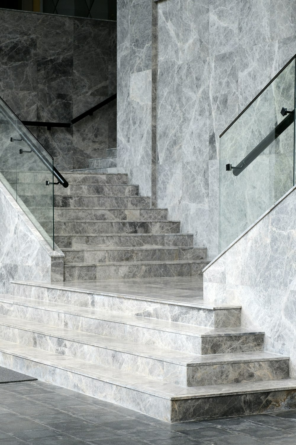 a stone staircase with a stone wall