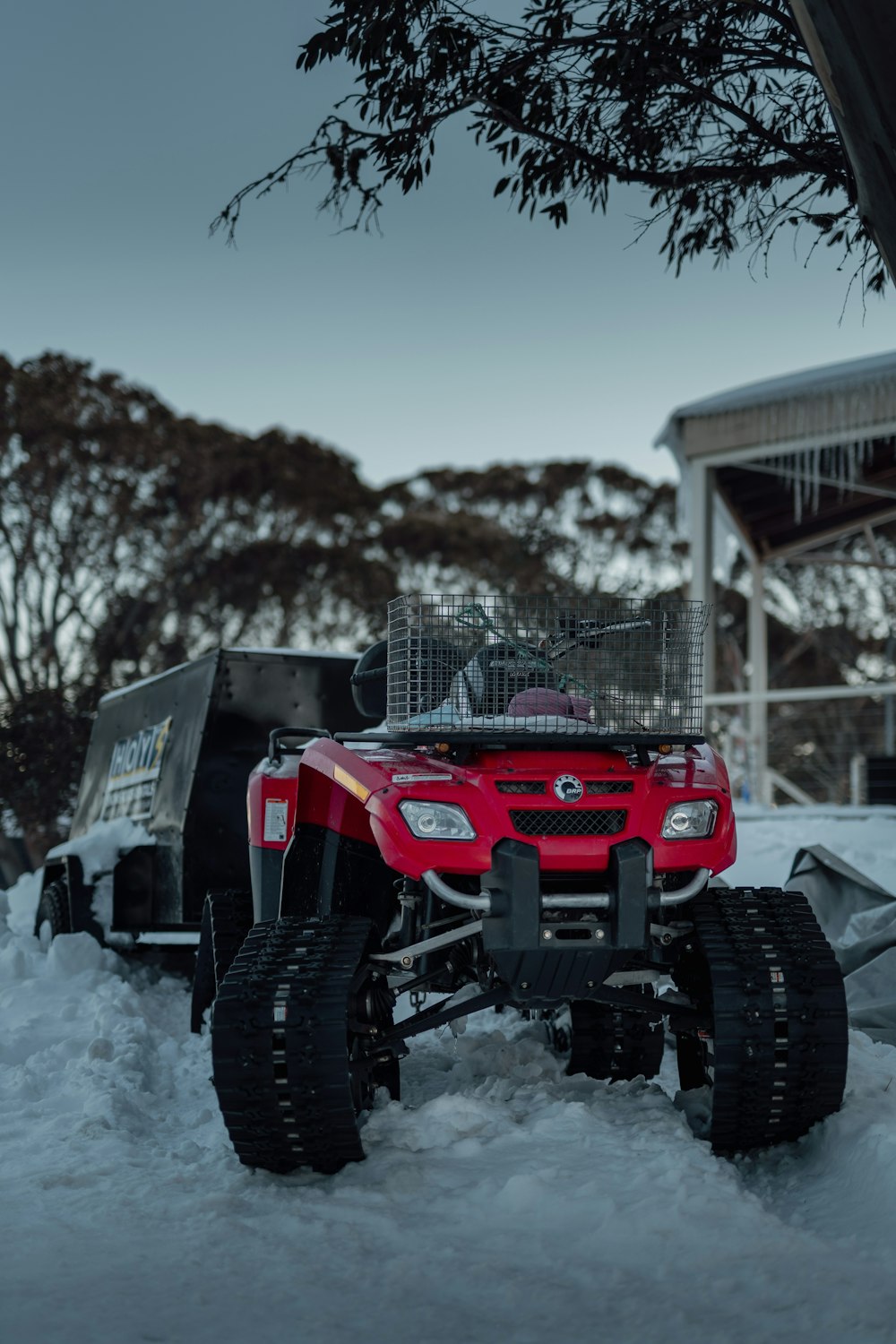 a red tractor in the snow