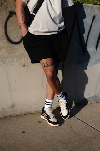 a man with a backpack and shorts