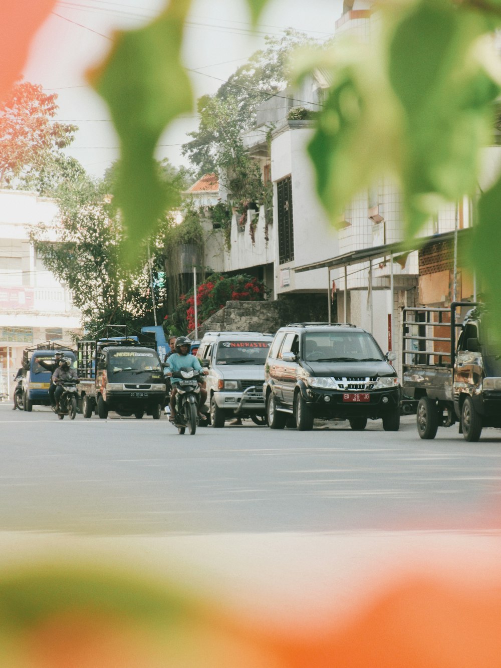 a person riding a motorcycle down a street