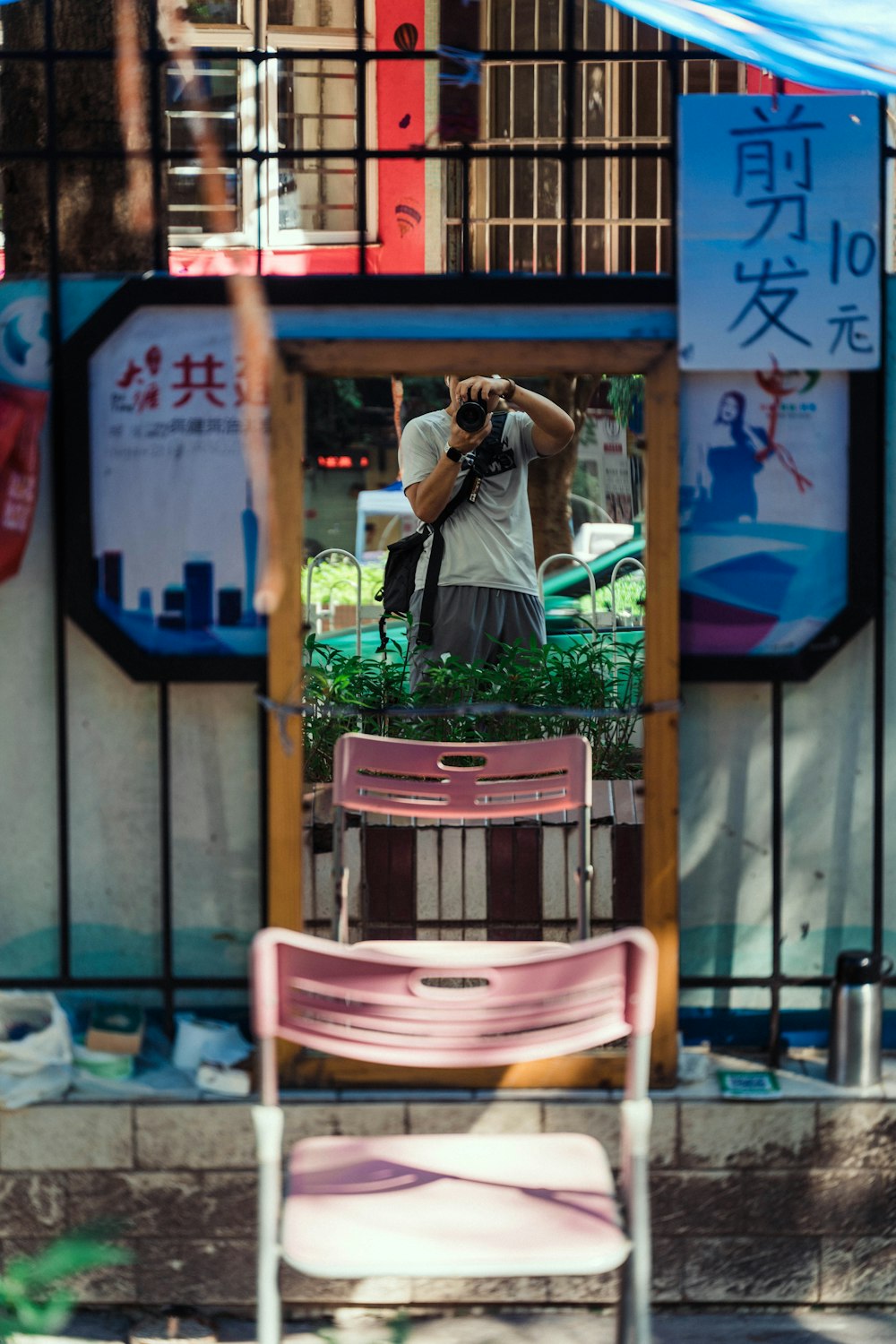 a person taking a picture of a chair and a table