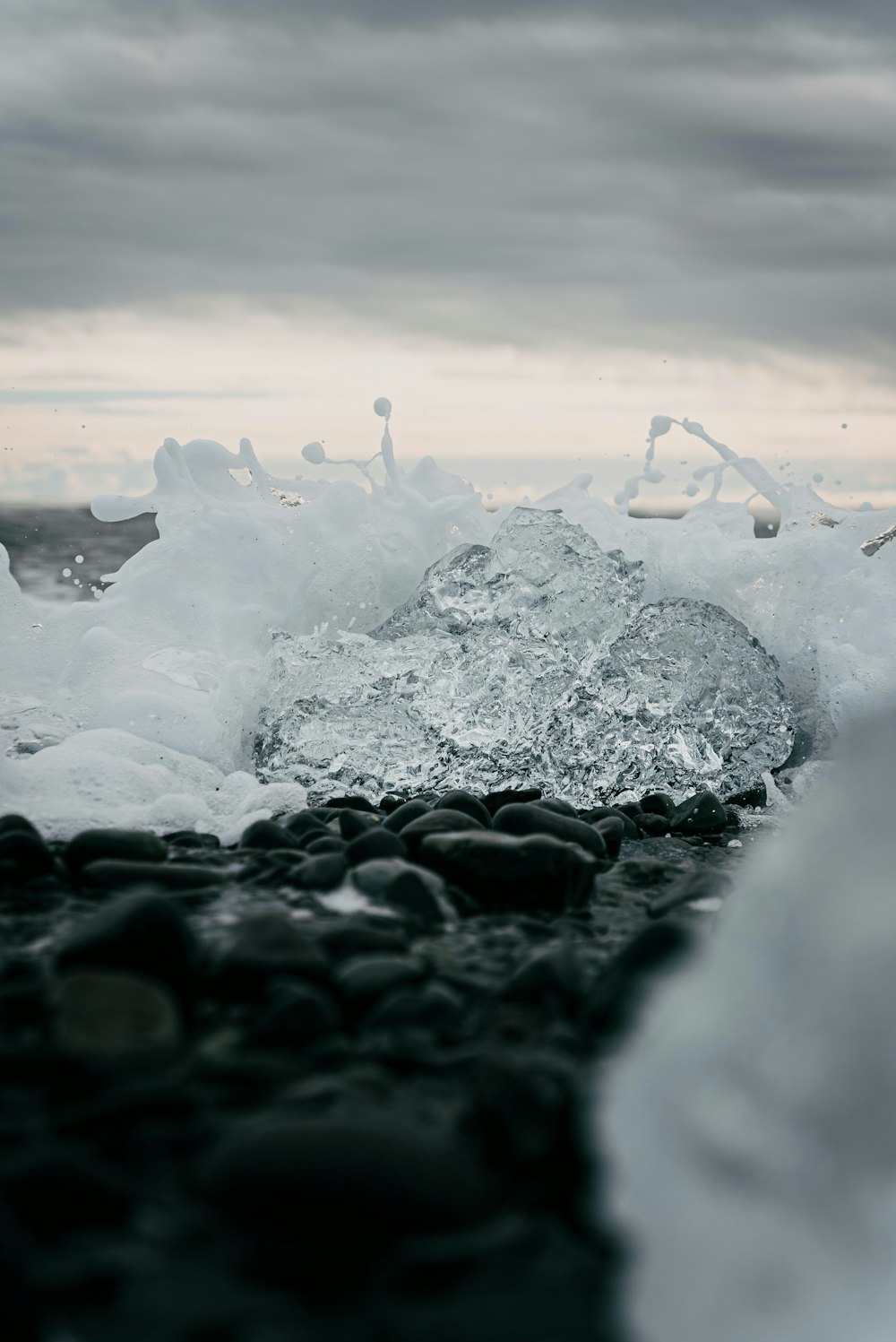 a rocky beach with waves crashing