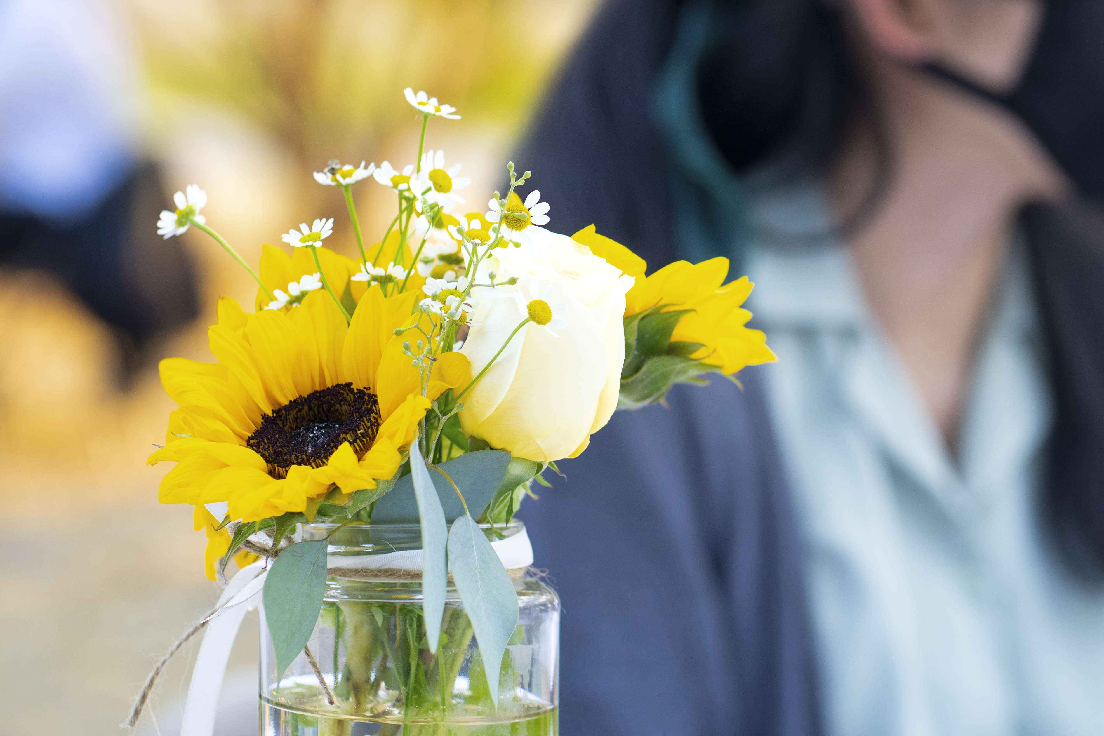 a person smelling flowers