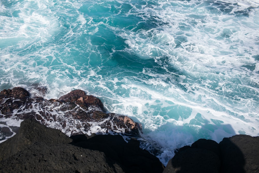 a rocky beach with waves crashing