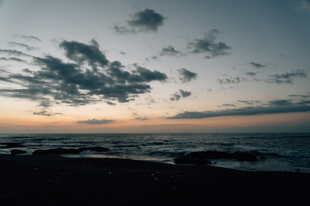 a beach with rocks and water