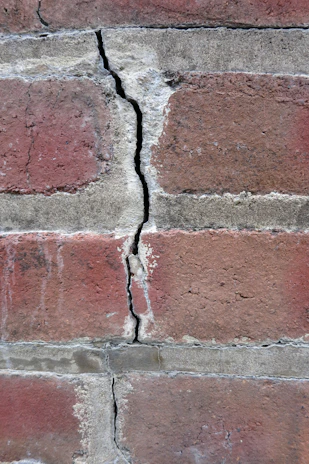 a brick wall with a hole in it