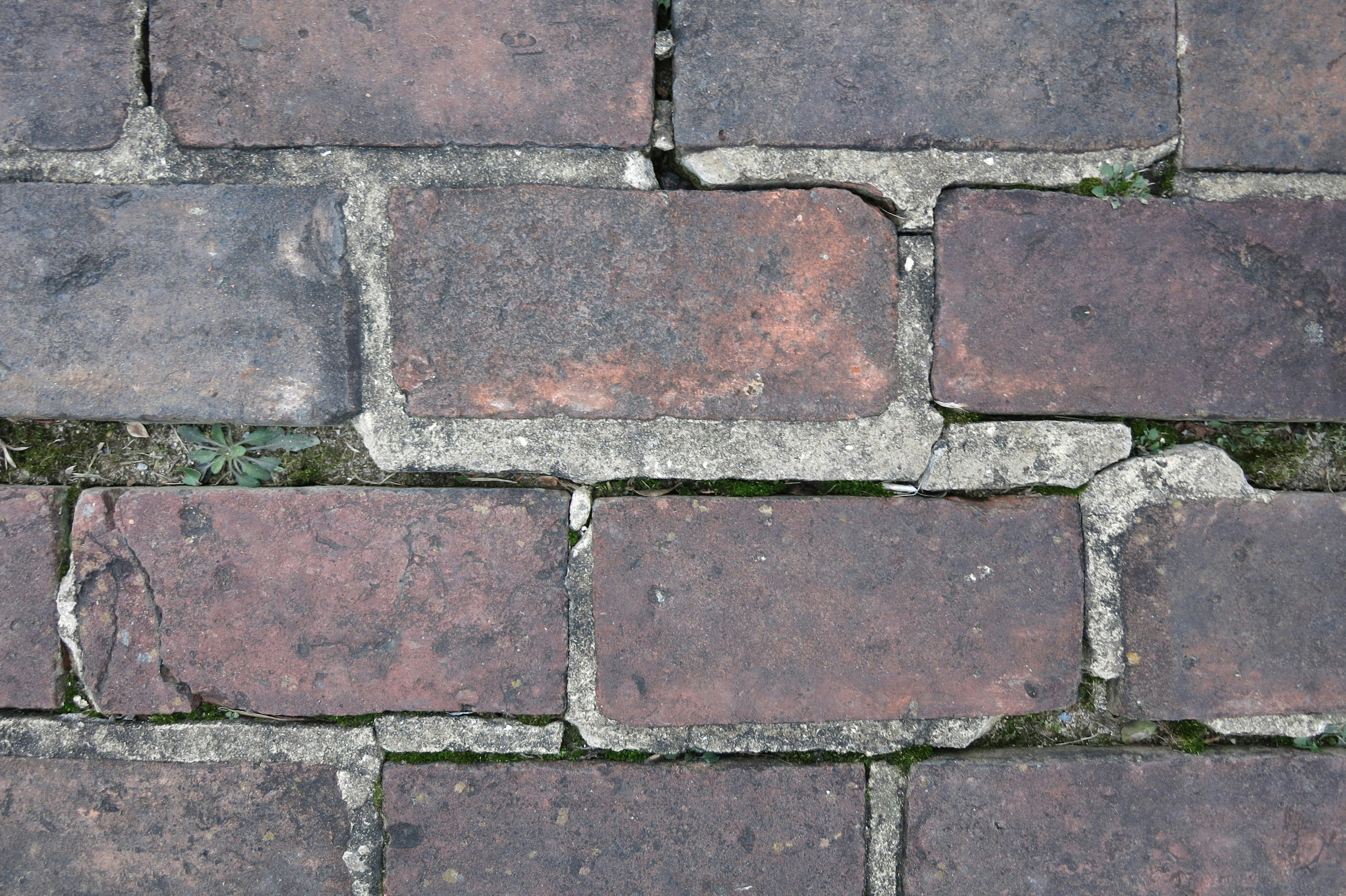 a brick wall with a hole in it