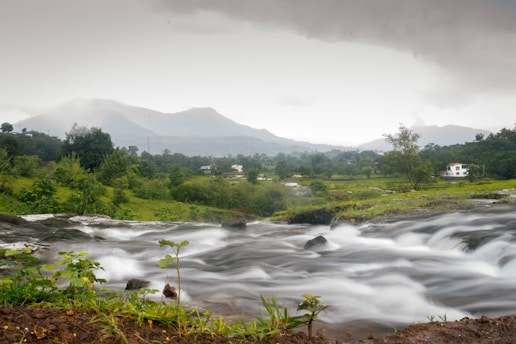 a river running through a valley near Karjat Resort