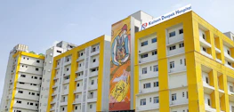 Exterior view of Bal Gopal Arogya Niketan hospital building with clear signage at Panchasheel Square.