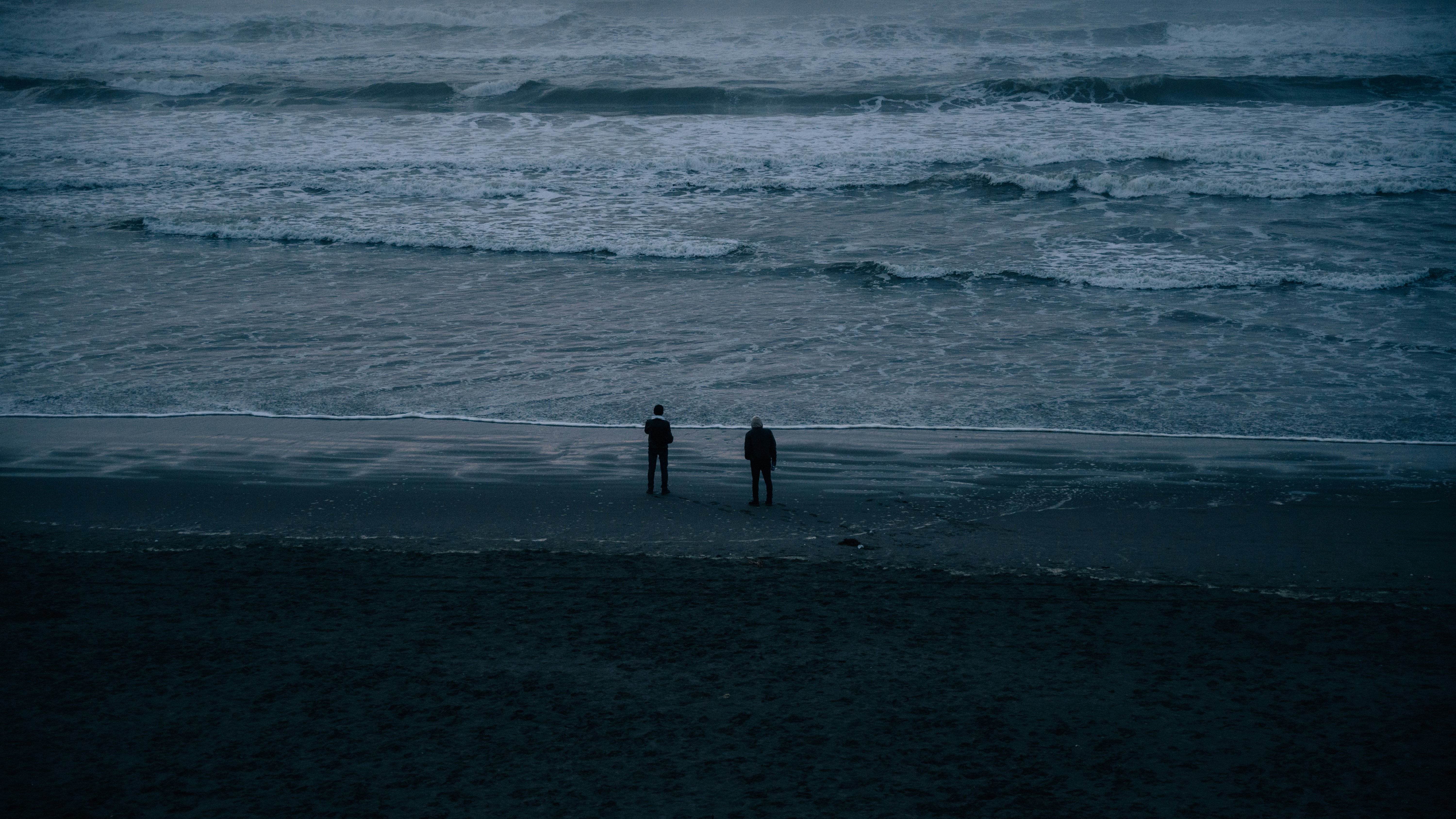 people walking on the beach
