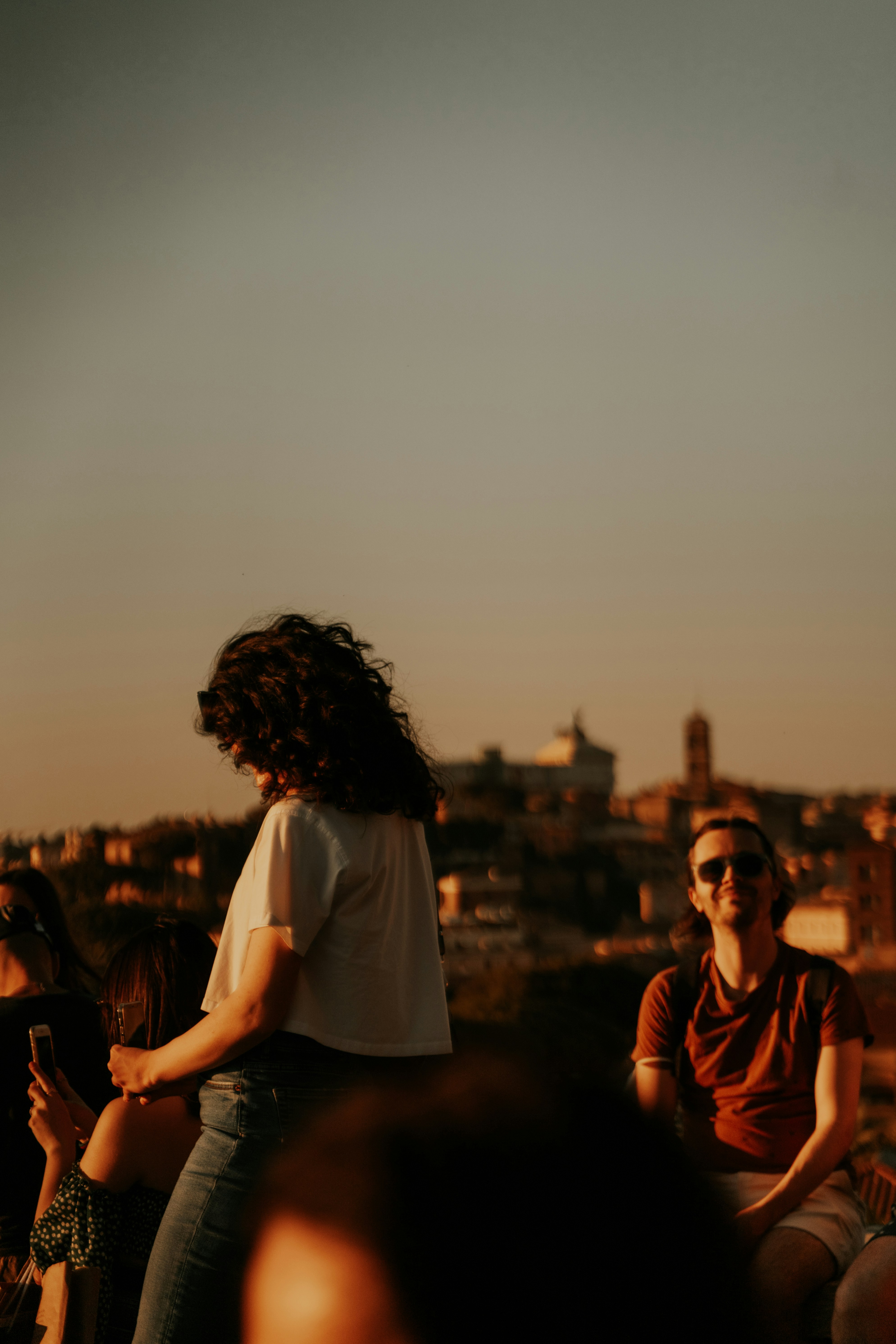 a group of people sitting on a ledge