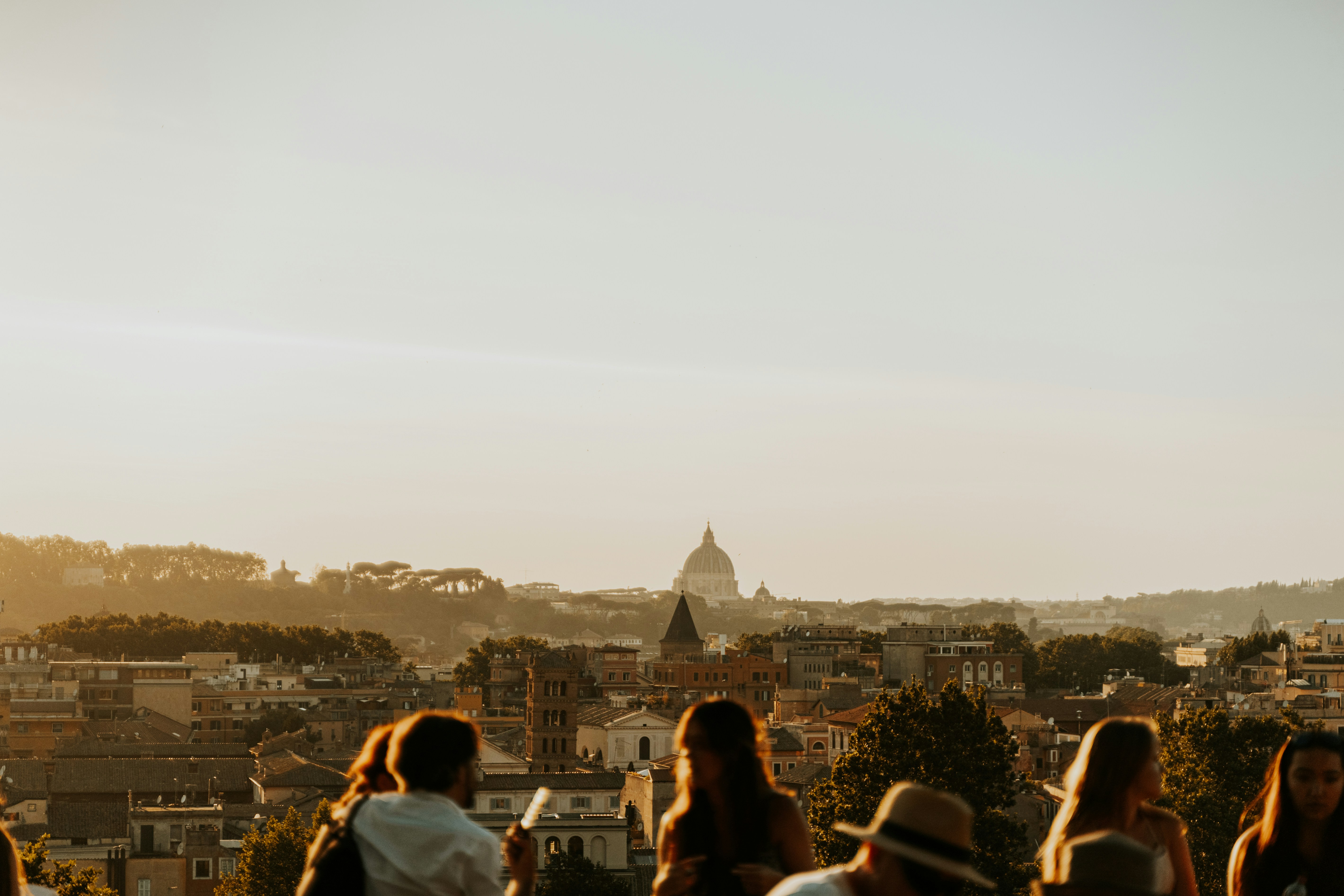 a group of people looking at a city