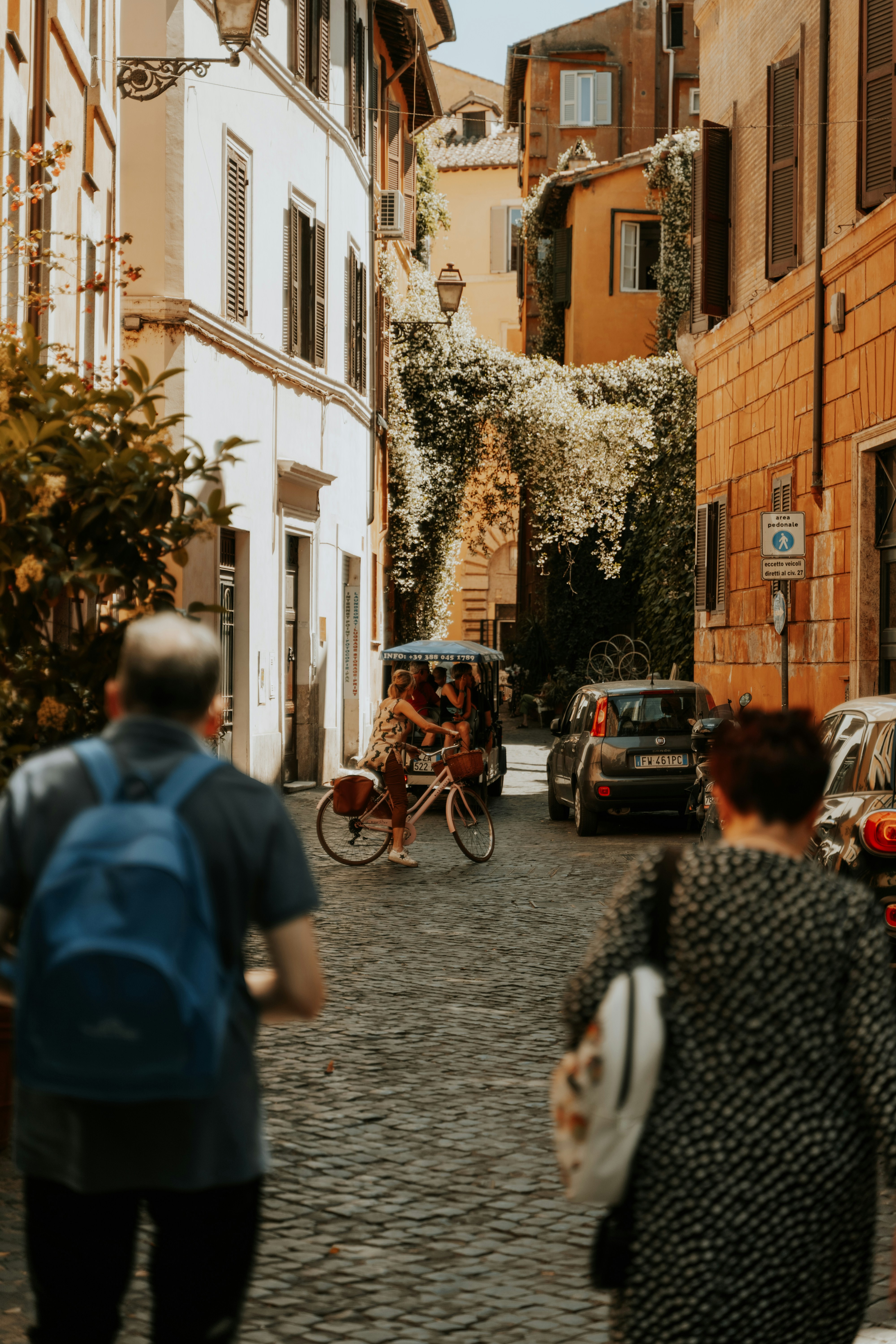 a person riding a bicycle down a street