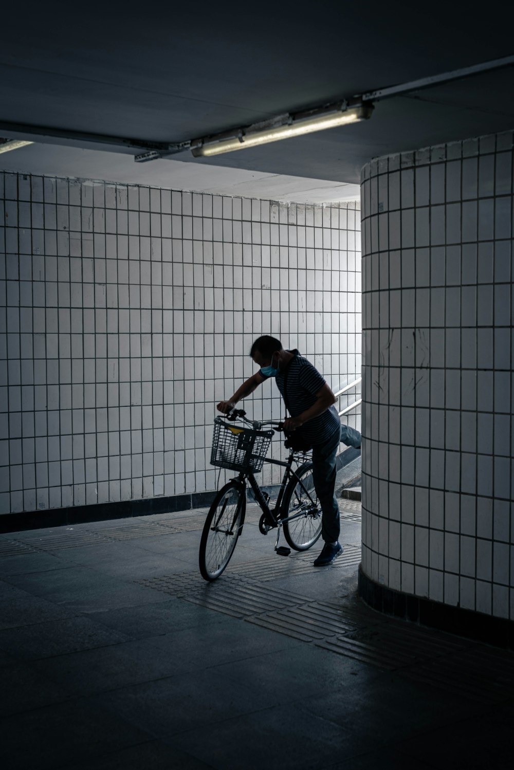 a person riding a bike in a hallway