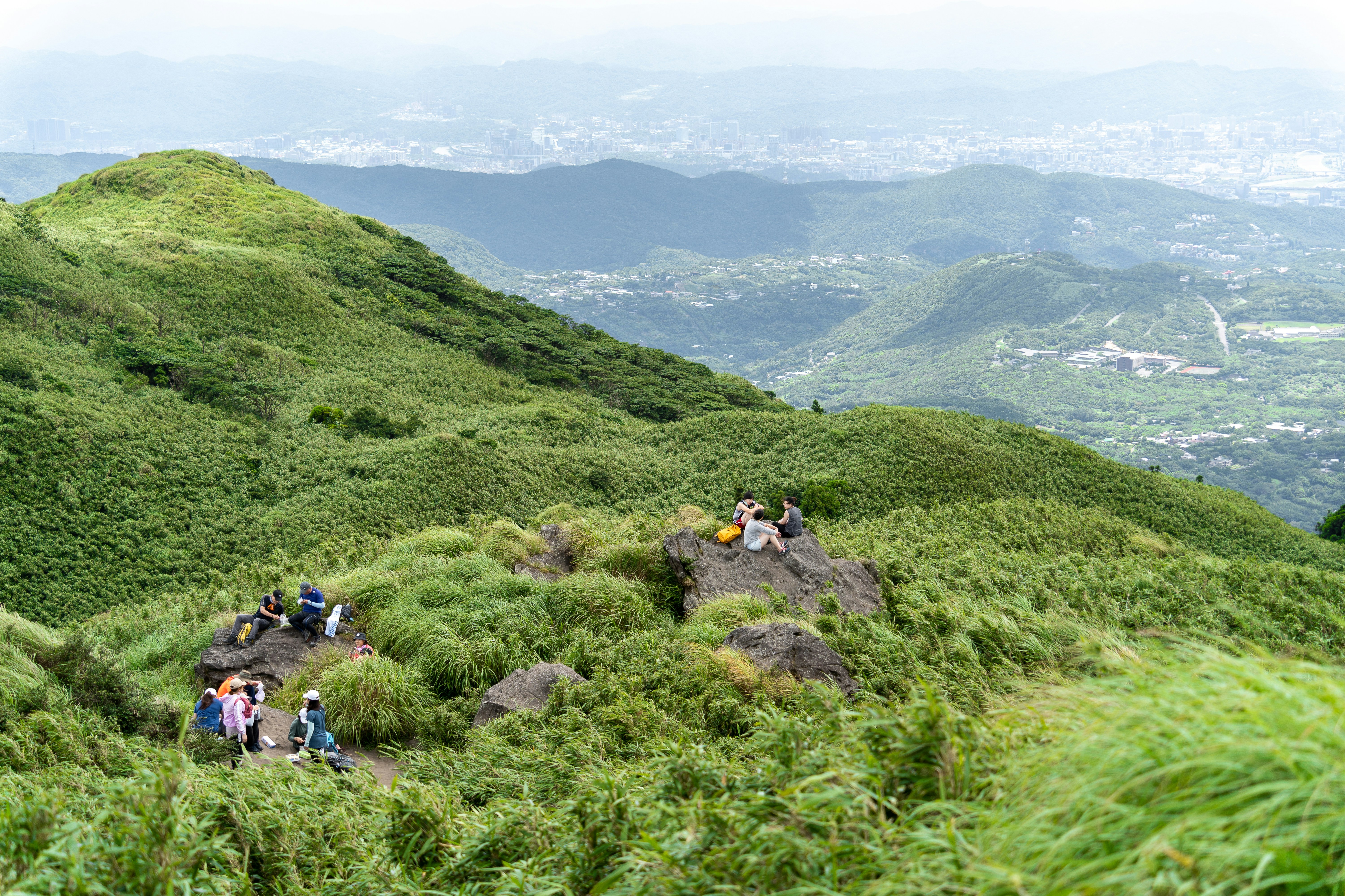 a group of people on a rock, 