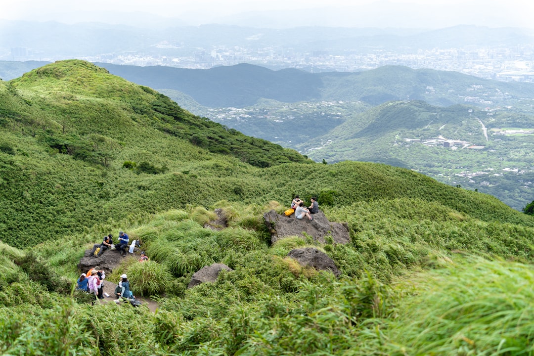 a group of people on a rock,
