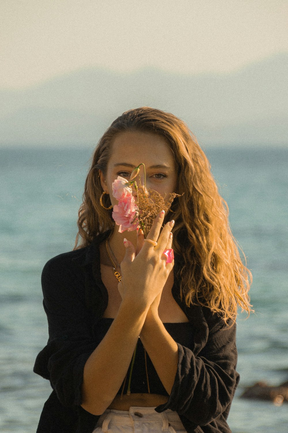 a woman with her hands on her face