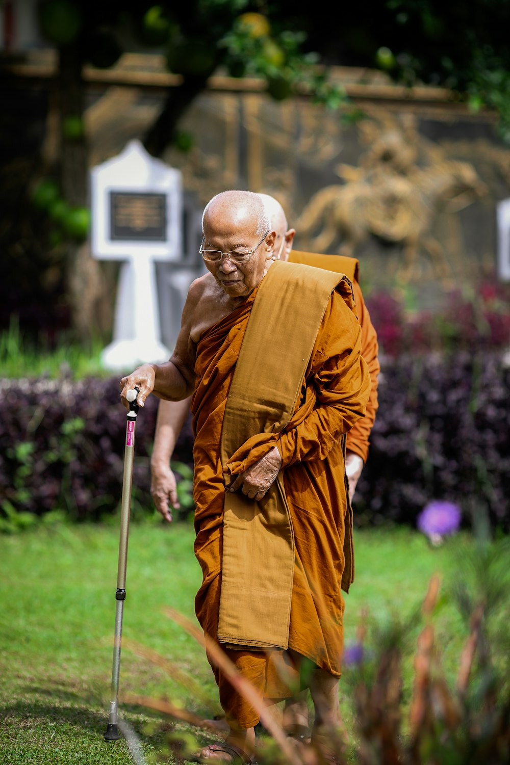 a man in a robe holding a cross