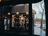 a group of people sitting at a table outside