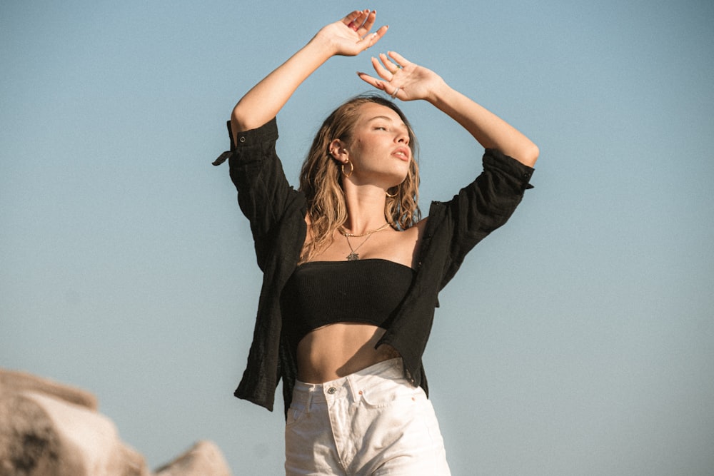 a woman with her hands up