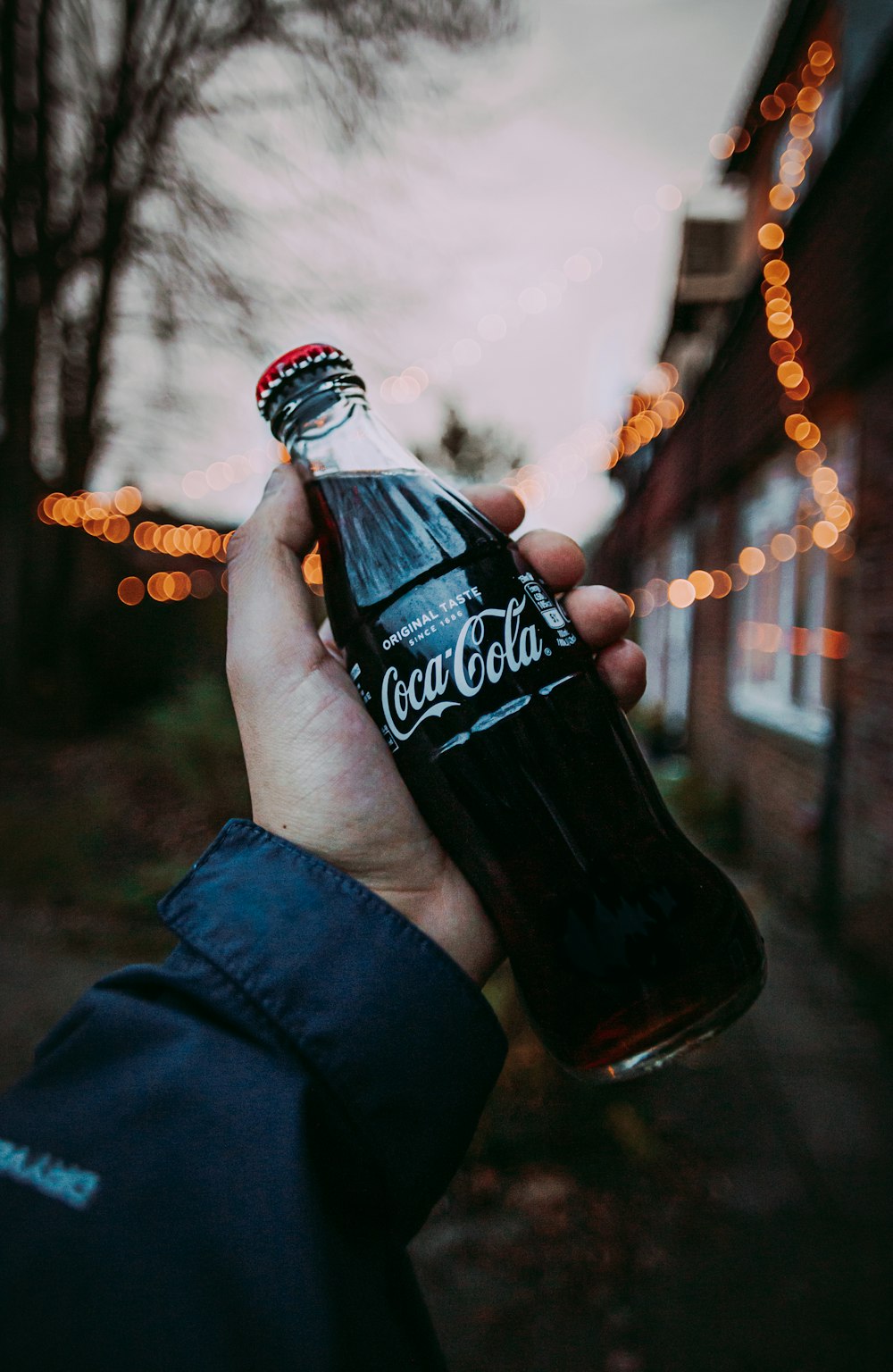 a person holding a bottle