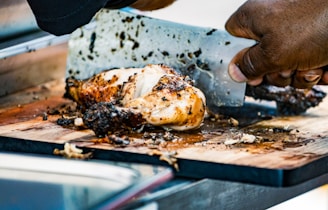 a person is holding a piece of food