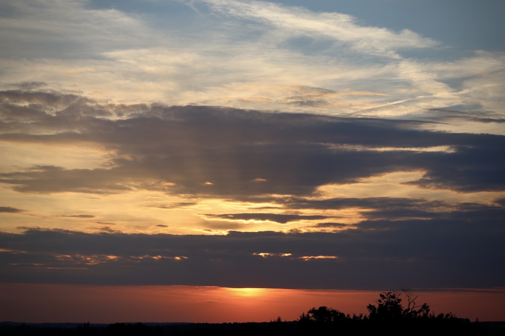 a sunset with clouds