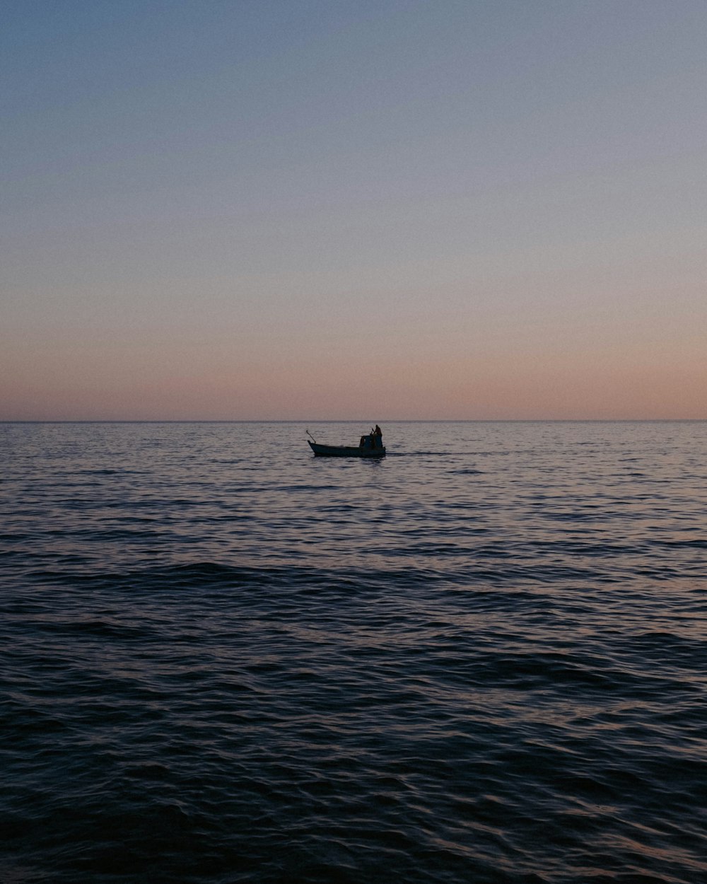 a person in a boat on the water