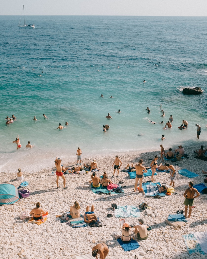 Turquoise shallows and a pebble beach seen from above