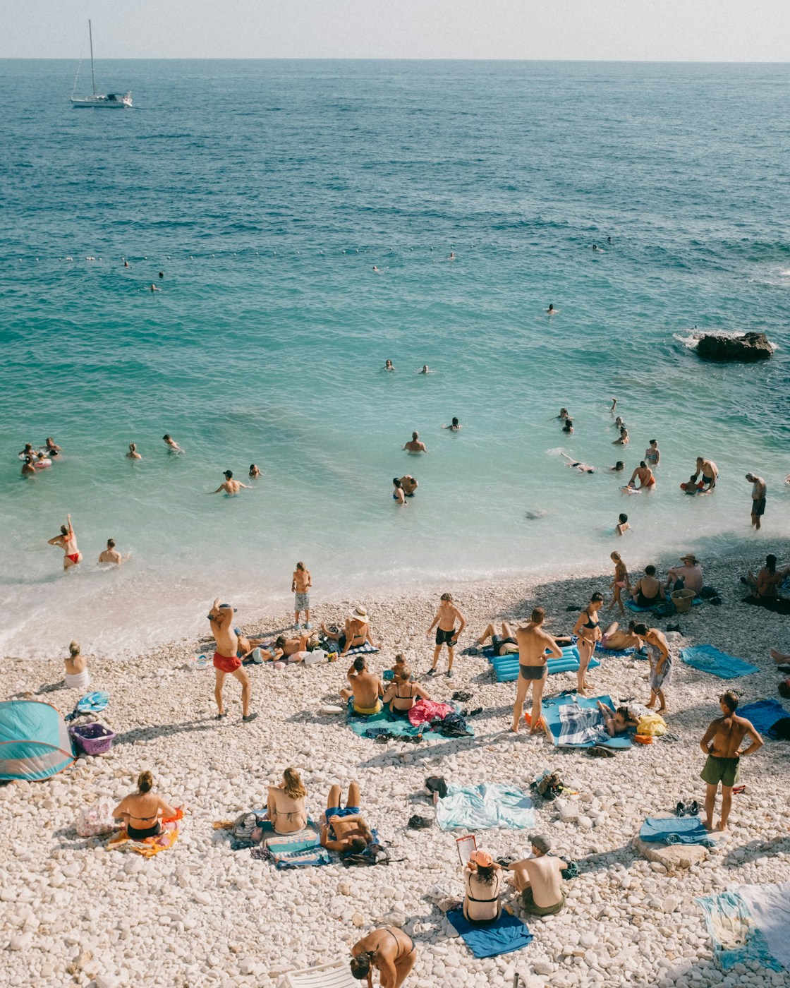Turquoise shallows and a pebble beach seen from above