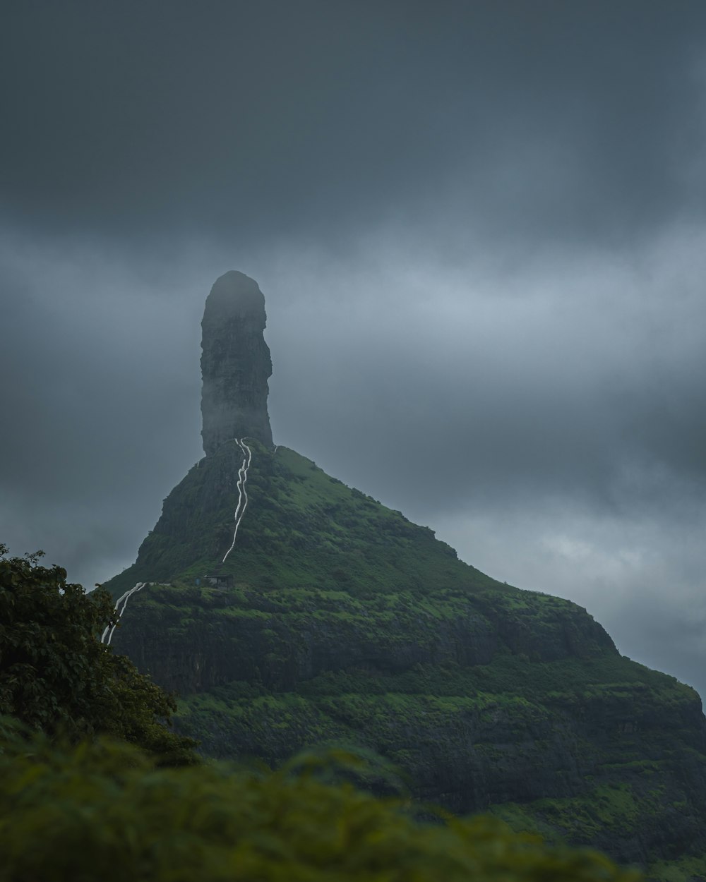 a mountain with a tower on top