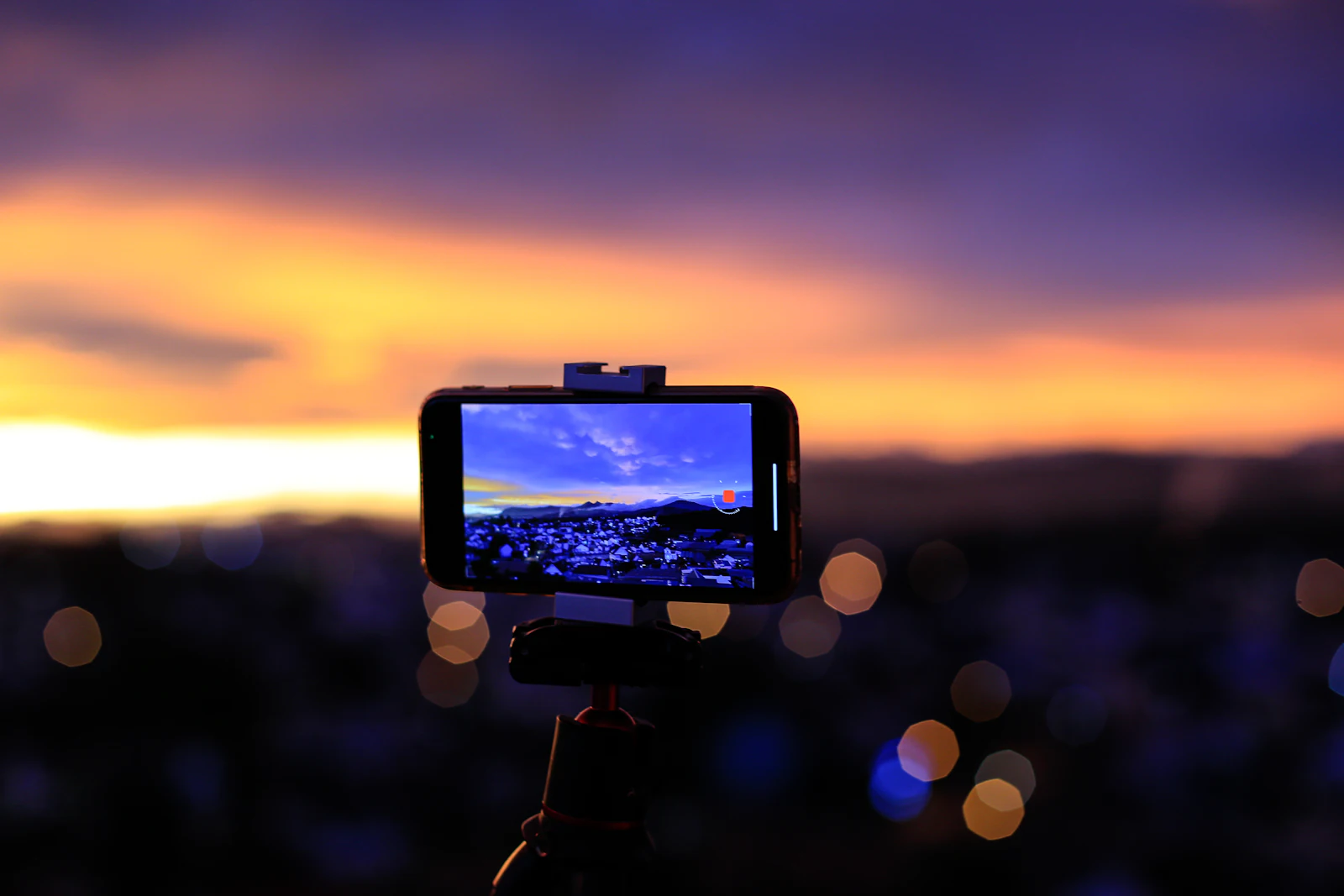 A camera on a tripod ready to film