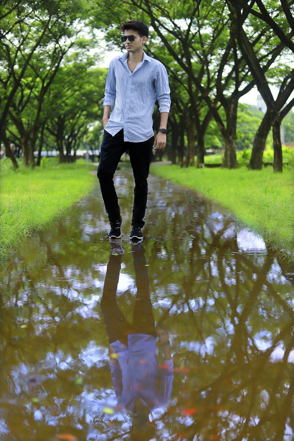 a man walking in a puddle