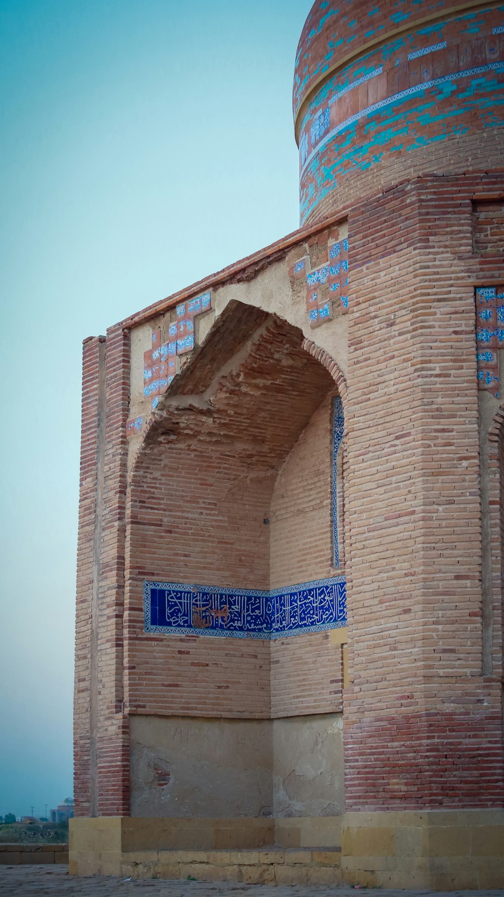 a brick building with a sign on it