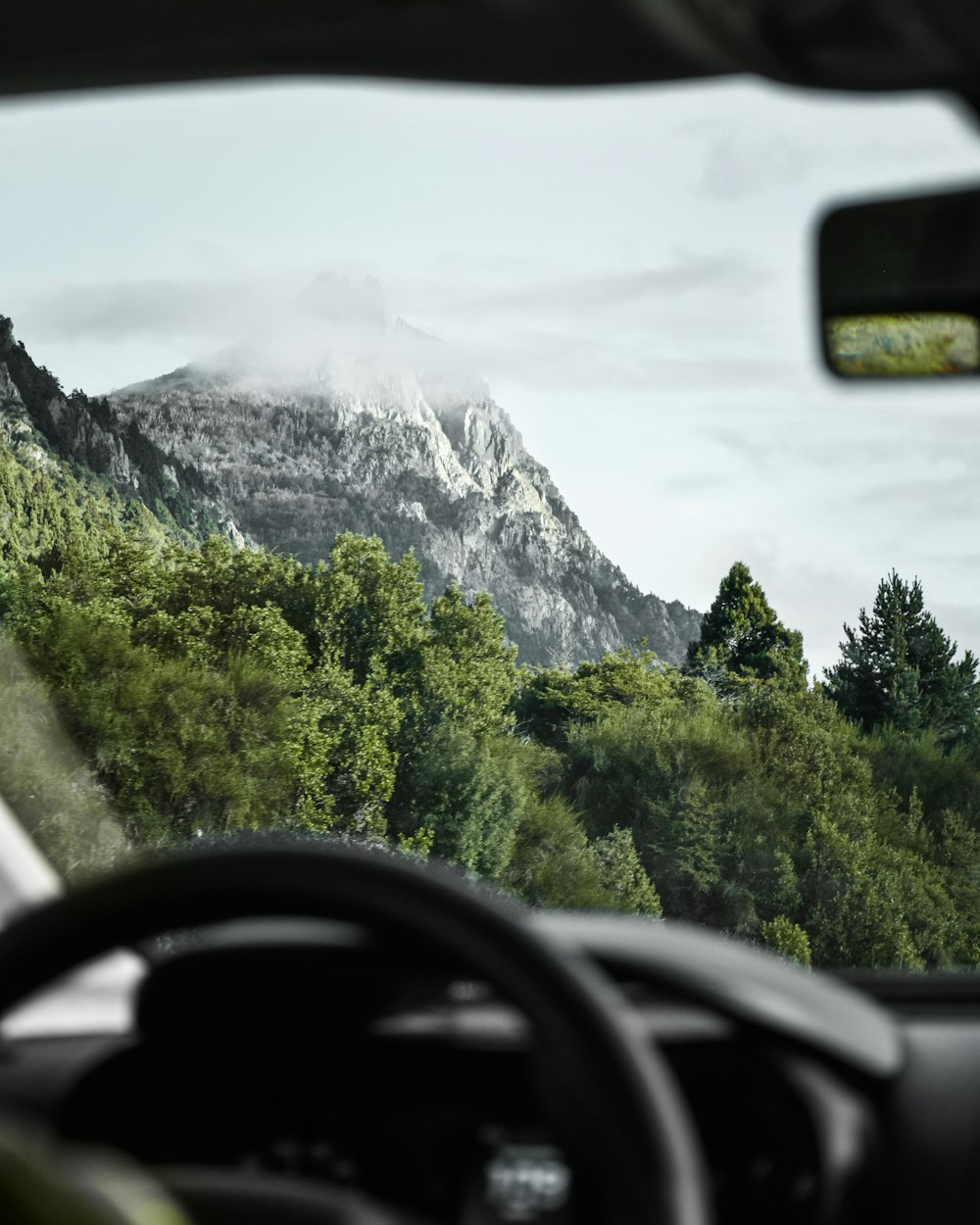 a view of a mountain from a car