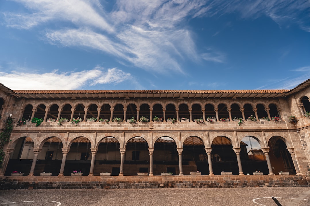 a large circular building with arches,