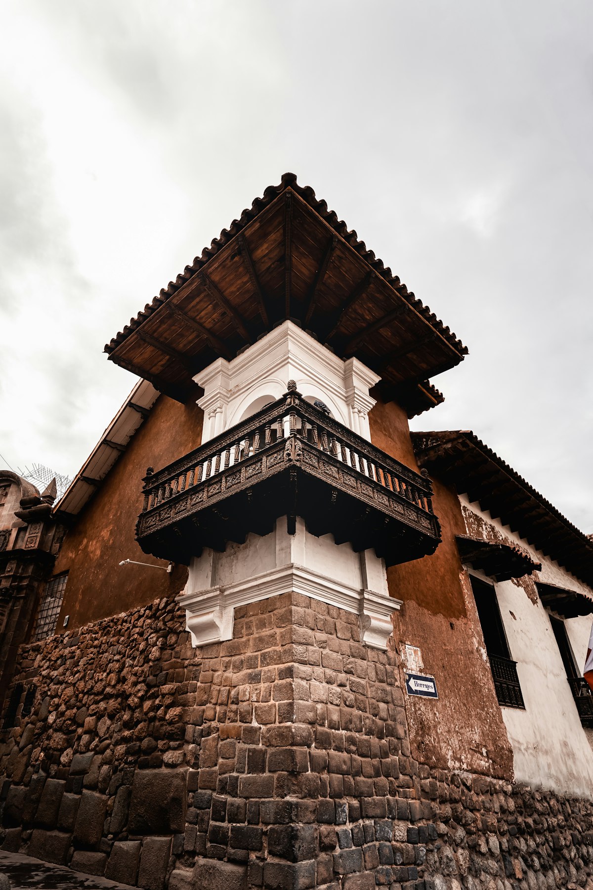 San Blas Cusco — a colonial bell tower rises above the rooftops of the historic craftsmen's quarter