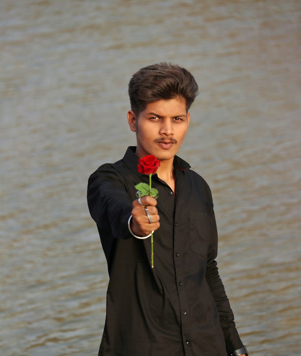 a man holding a rose