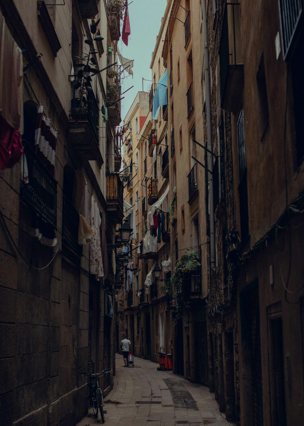 a person walking down a narrow street