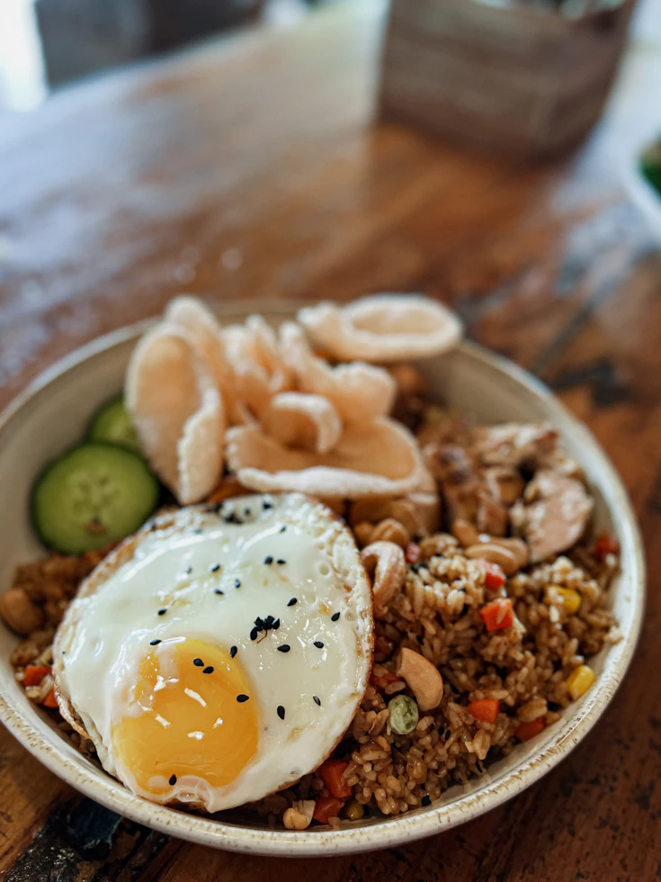 Indonesian Nasi Goreng with egg and crackers