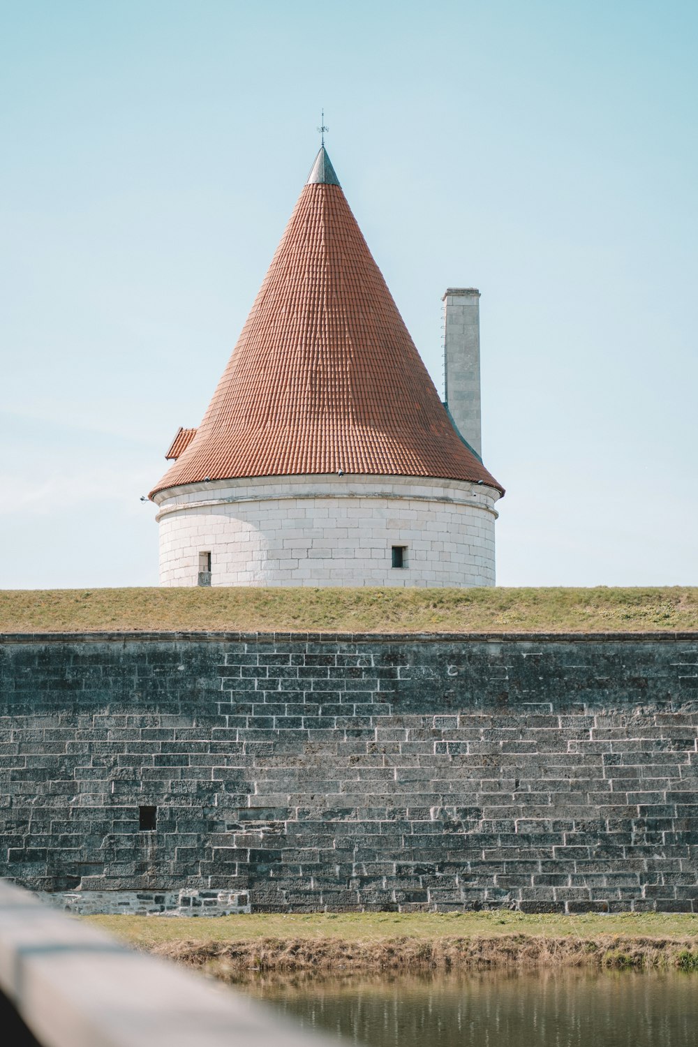 a white building with a red roof