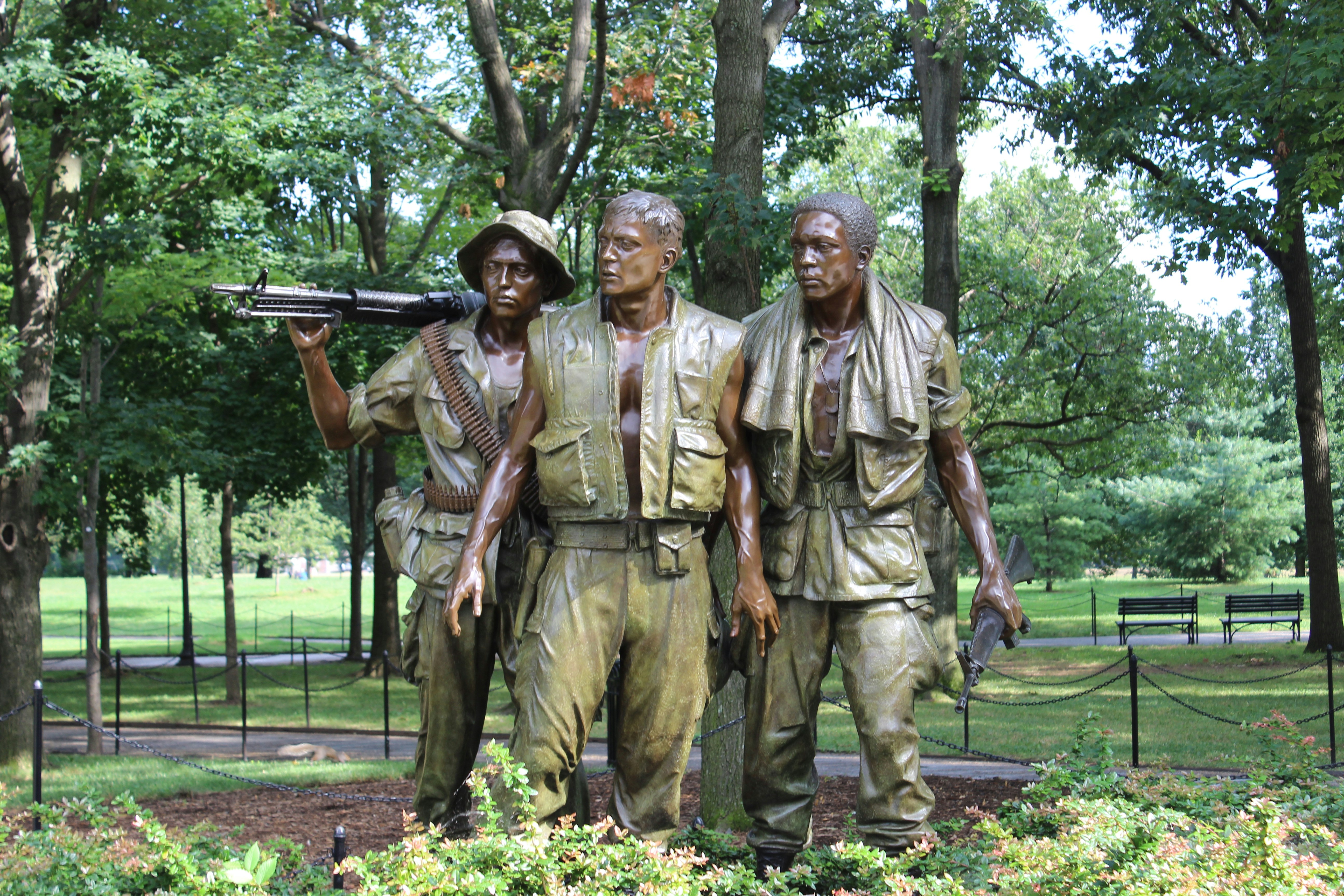a group of people in military uniforms holding guns