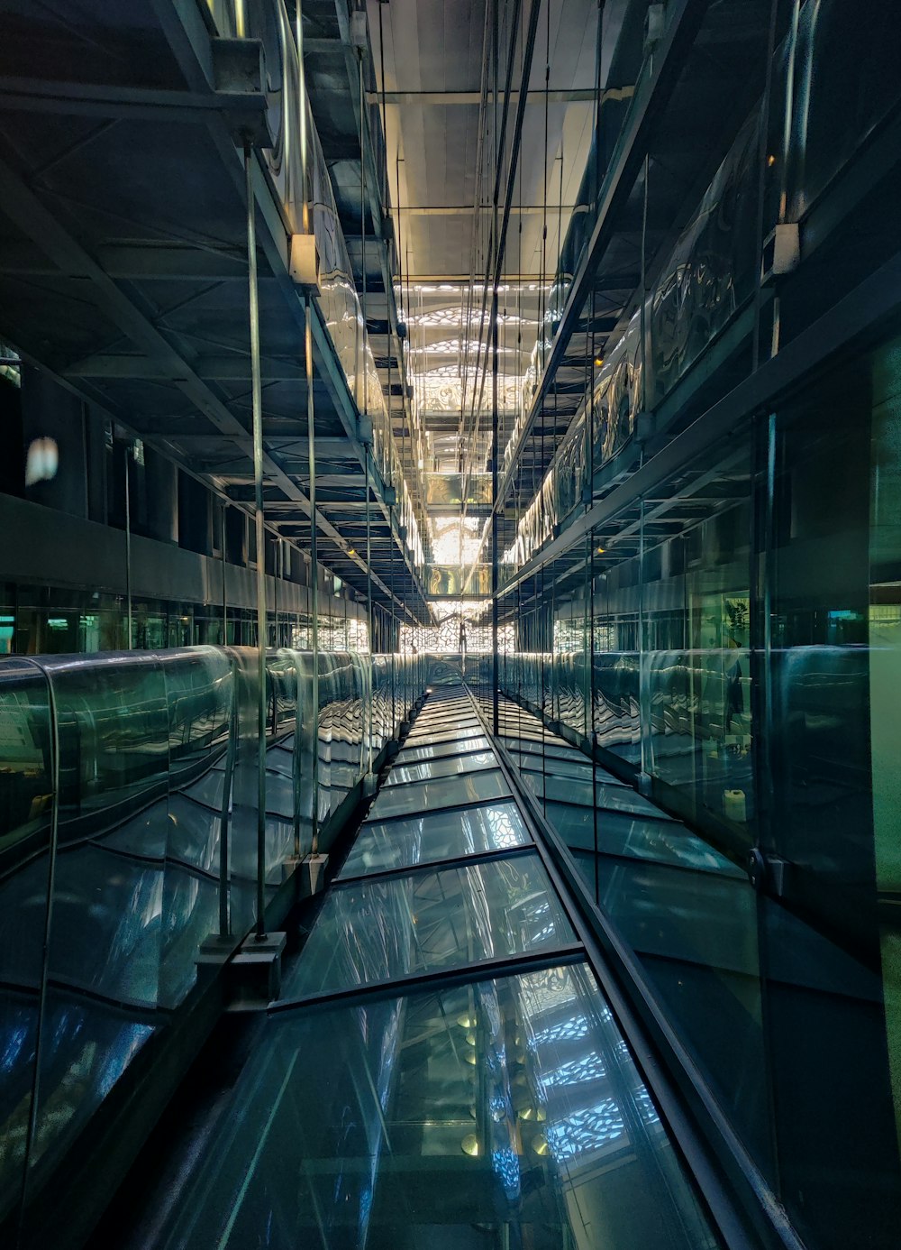 a large glass building with a staircase