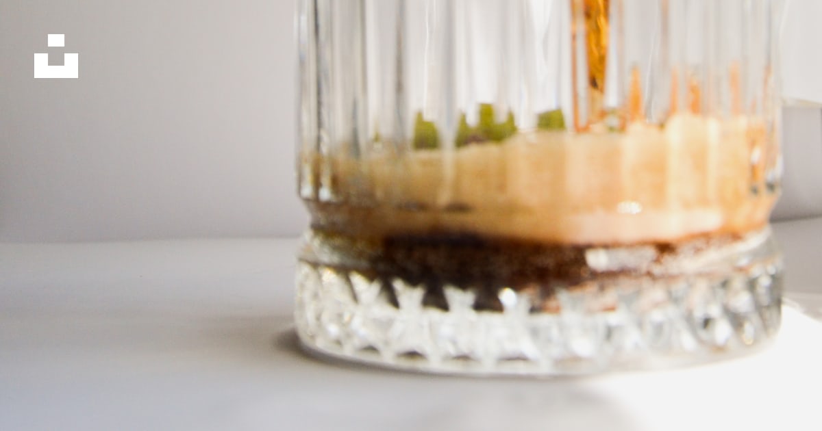 A glass jar with a liquid in it photo – Free Colddrinks Image on Unsplash