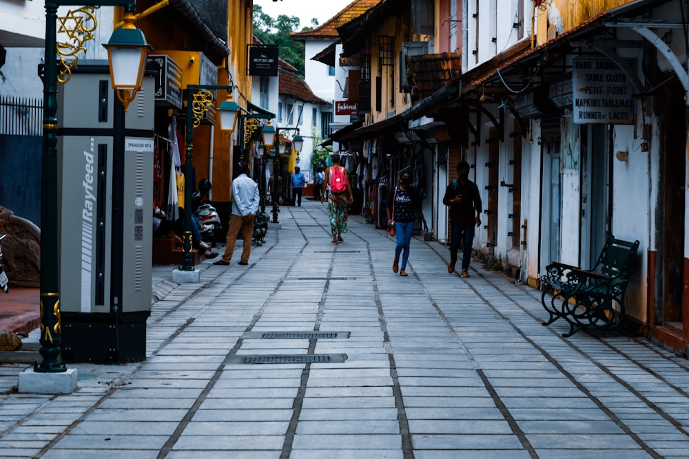 people walking down a sidewalk