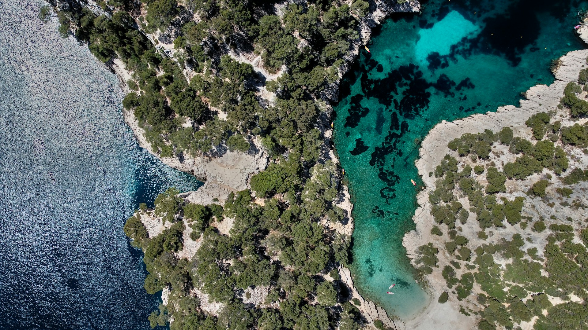 a body of water with land in the back
