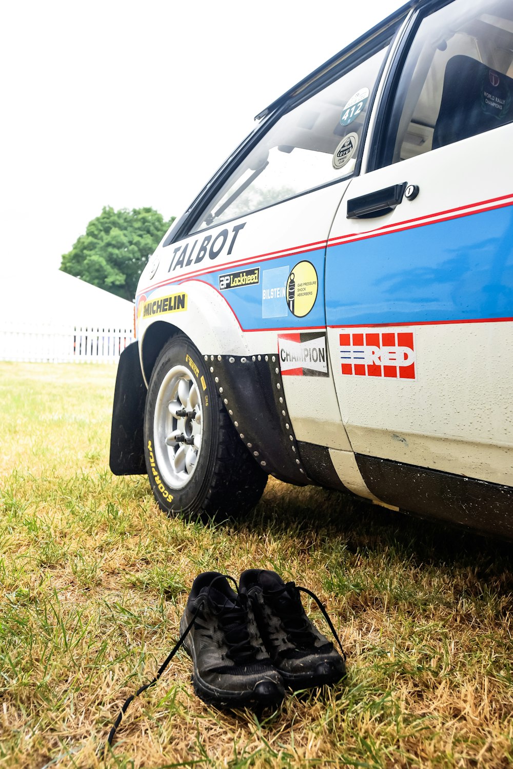 a police car parked in a grassy field
