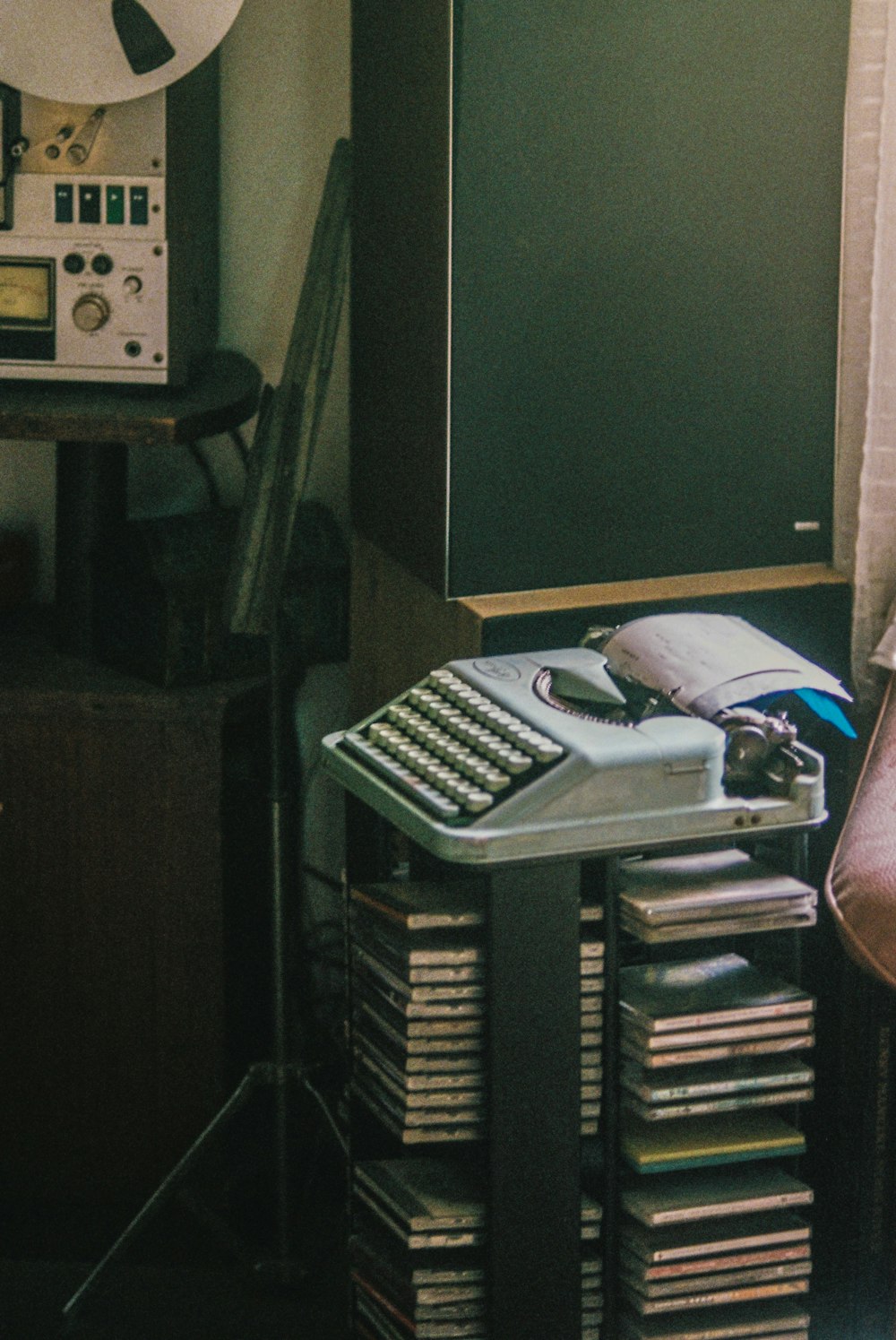 a piano with a keyboard and a stack of books